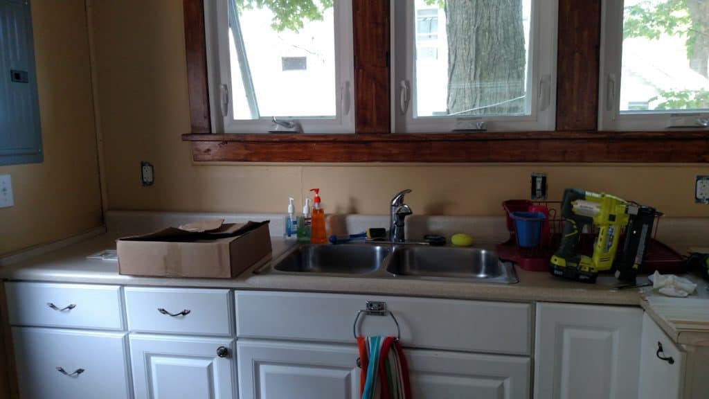 Adding PVC beadboard to a kitchen backsplash adds a cottage look and is perfect for a wet area