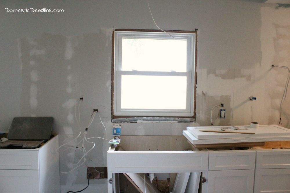 Installing Kitchen Cabinets in our DIY Kitchen - Domestic Deadline