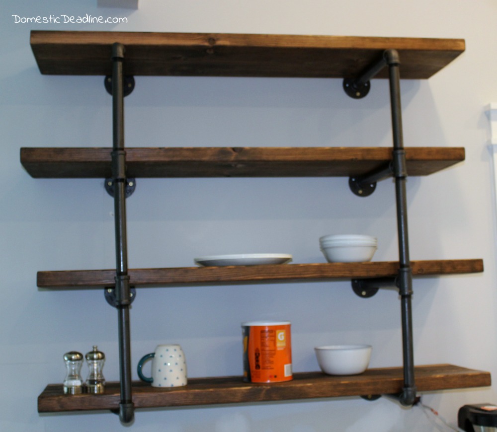 Using iron pipe, thick wood planks, spray paint and stain, I created the perfect industrial shelving for my DIY farmhouse kitchen. I'll show you how on Domestic Deadline