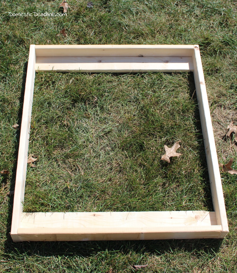 Using an old frame, a piece of pegboard and some scrap lumber I'll show you how I created a cabinet to store paint and organize craft supplies - Domestic Deadline