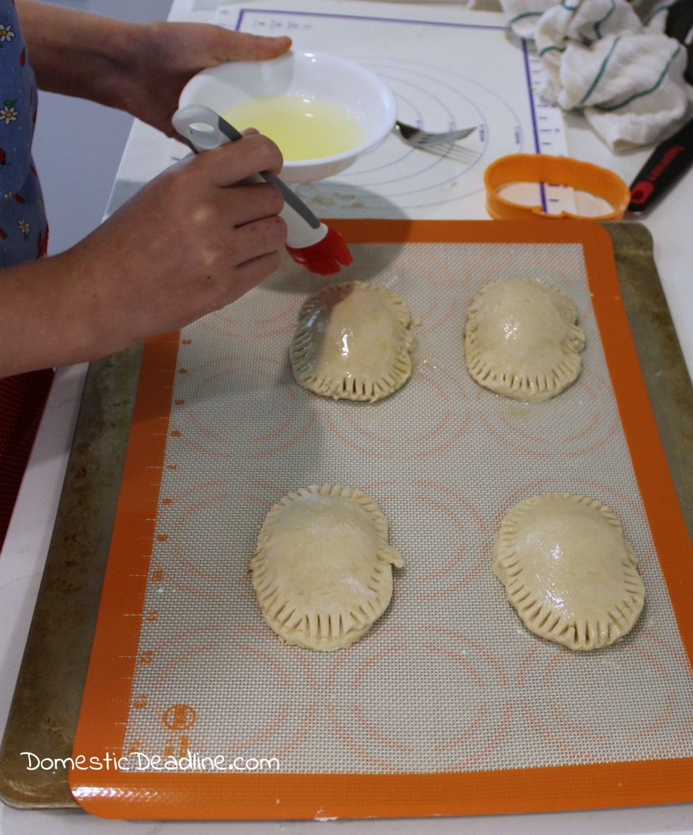 Pumpkin filling in a flaky gluten-free crust drizzled with a butterbeer frosting makes the perfect treat for a Harry Potter movie marathon. Pumpkin Pasties - Domestic Deadline