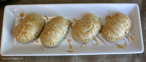 Pumpkin filling in a flaky gluten-free crust drizzled with a butterbeer frosting makes the perfect treat for a Harry Potter movie marathon. Pumpkin Pasties - Domestic Deadline