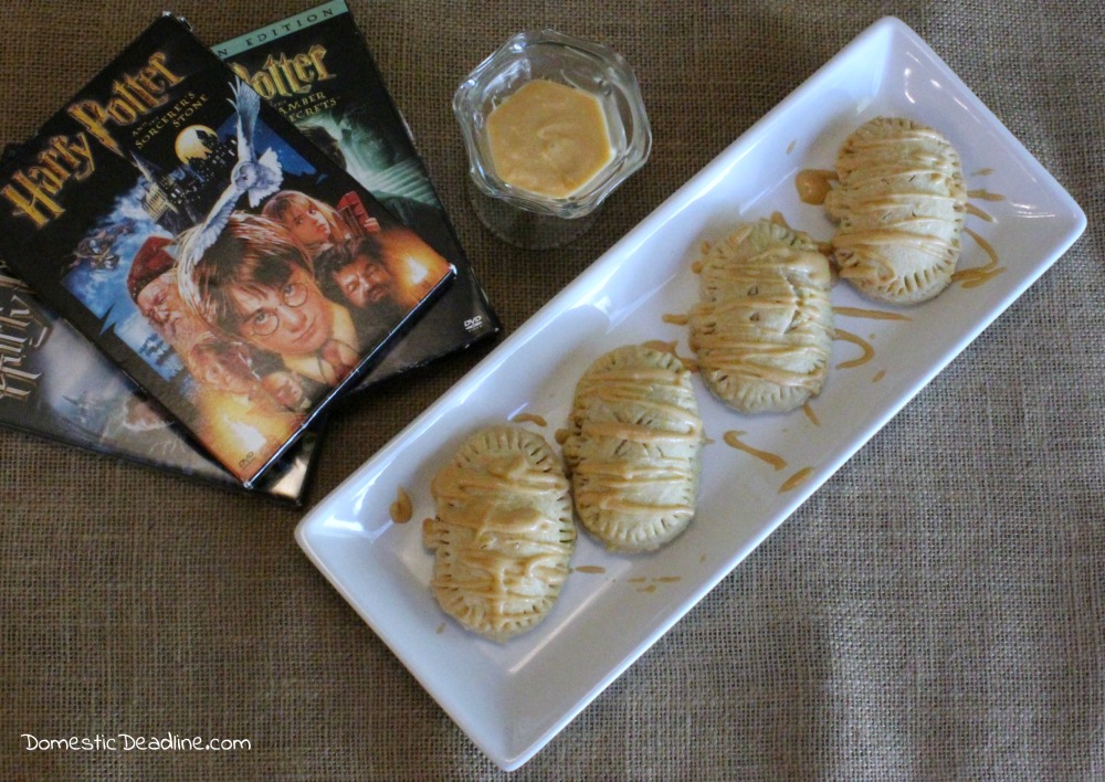 Pumpkin filling in a flaky gluten-free crust drizzled with a butterbeer frosting makes the perfect treat for a Harry Potter movie marathon. Pumpkin Pasties - Domestic Deadline