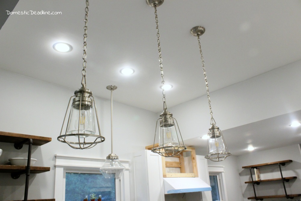 The pendant lights are pulling my fixer upper kitchen together. Combining brushed nickel and glass into the vintage, industrial, farmhouse look I love