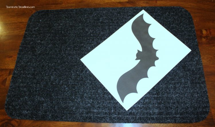Try this simple dollar store craft using doormats! Easily turn them into bat walkway mats for festive Halloween decor. Quick, fun, and cheap! Domestic Deadline