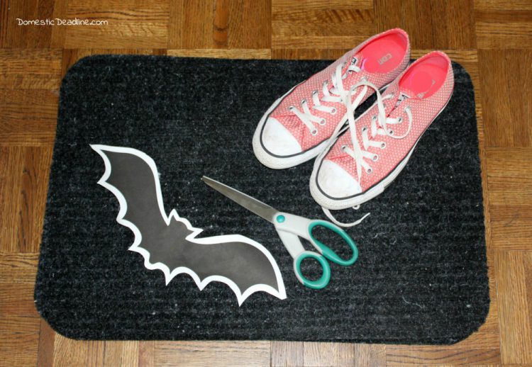 Try this simple dollar store craft using doormats! Easily turn them into bat walkway mats for festive Halloween decor. Quick, fun, and cheap! Domestic Deadline