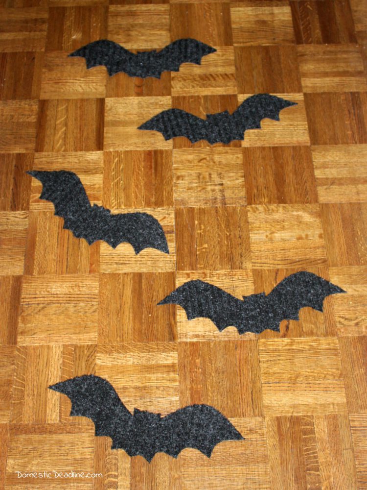 Try this simple dollar store craft using doormats! Easily turn them into bat walkway mats for festive Halloween decor. Quick, fun, and cheap! Domestic Deadline