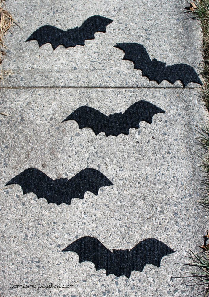 Try this simple dollar store craft using doormats! Easily turn them into bat walkway mats for festive Halloween decor. Quick, fun, and cheap! Domestic Deadline