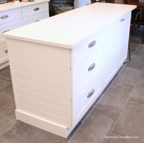 Using standard cabinets and some basic construction tools I'll show you how I customized my kitchen island to have the farmhouse feel I wanted - Domestic Deadline