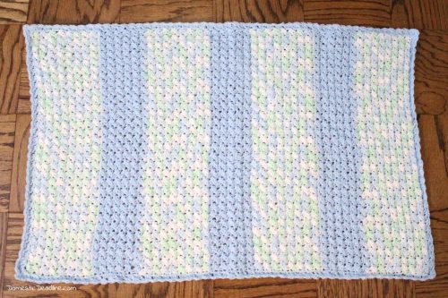 Easy crochet baby blanket great for using up yarn you have on hand. Free Pattern! Plus, lots of great ideas for using the craft supplies you already have. Domestic Deadline