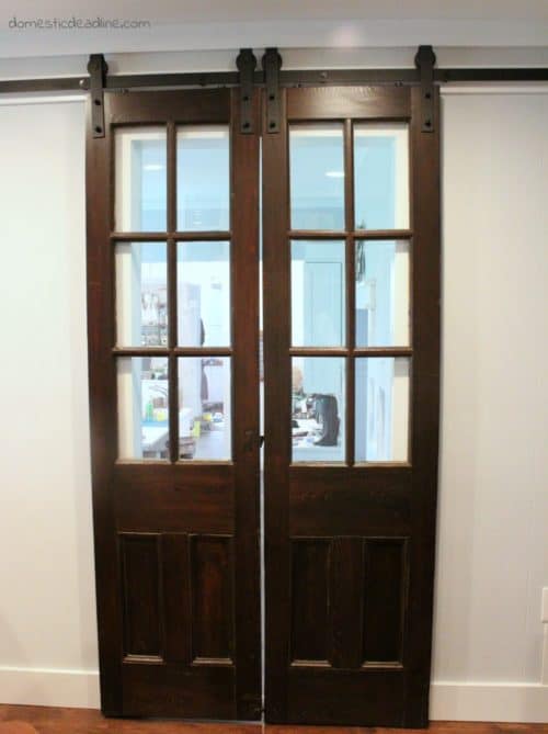 Ever watch Fixer Upper and wish you could incorporate antique and/or barn doors into your home decor? Check out these 1800s church doors turned into a feature in our real home. Do not adjust your TV! Domestic Deadline