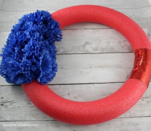 Fun, easy wreath to celebrate Memorial Day, Flag Day or 4th of July. Using supplies from the dollar store. Plus, tons of other Pinterest inspired projects www.domesticdeadline.com