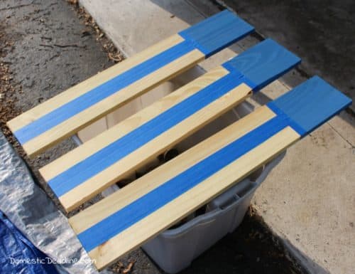 Leftover fence boards and chalk paint, turn into a simple outdoor wooden flag, perfect for Memorial Day, Flag Day, Independence Day or even all summer. http://domesticdeadline.com