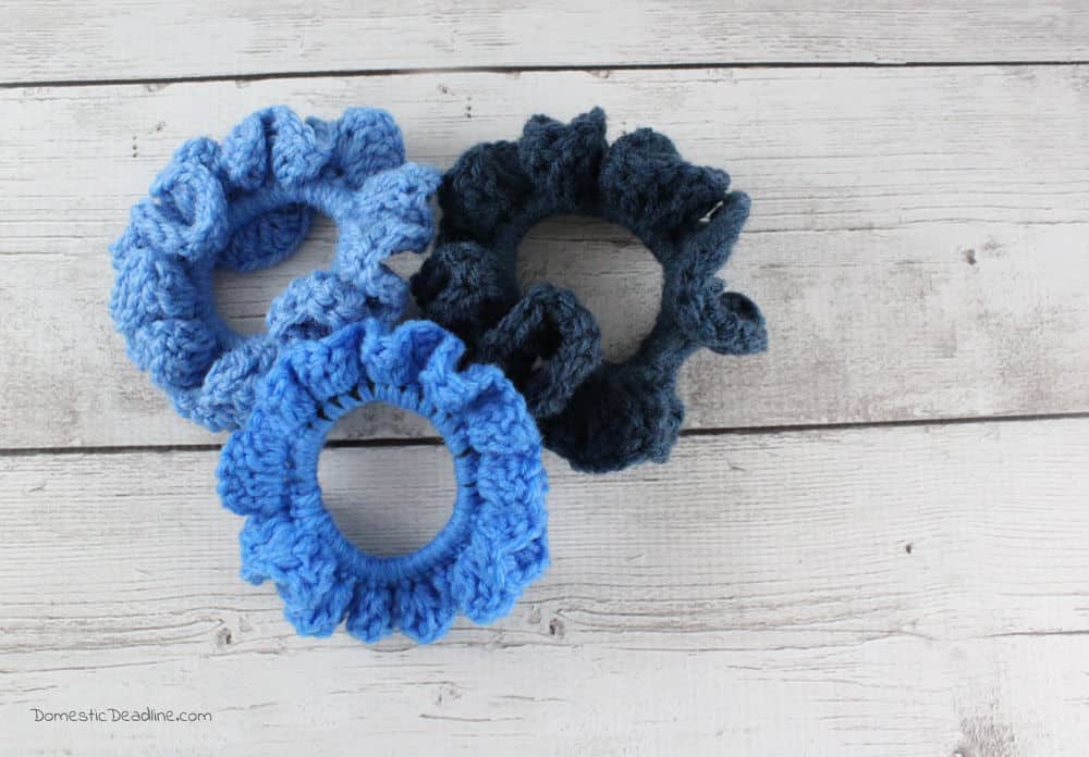 Crochet scrunchies are quick and easy stocking stuffers that work up quick and help use up the leftover yarn stash! Plus more de-stash projects #Craftroomdestash www.domesticdeadline.com