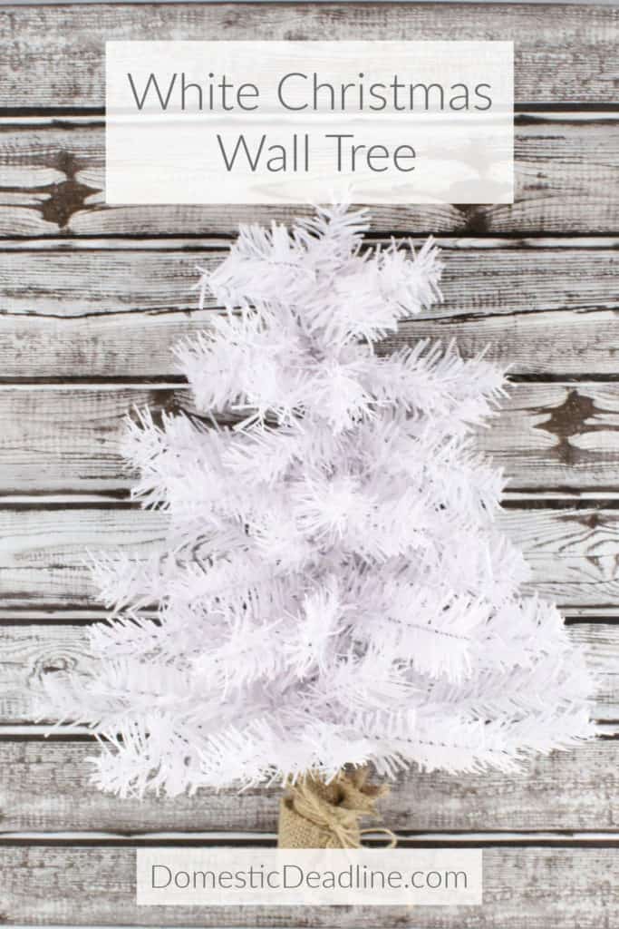 Learn how to make a rustic white Christmas wall tree with dollar store materials. Great for any winter decor, especially for a small space! DomesticDeadline.com