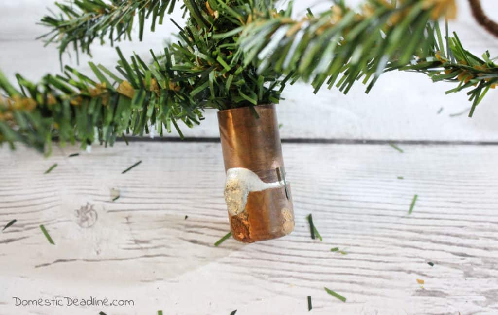 Learn how to make mini burlap wrapped trees with dollar store greenery and craft room supplies. DomesticDeadline.com