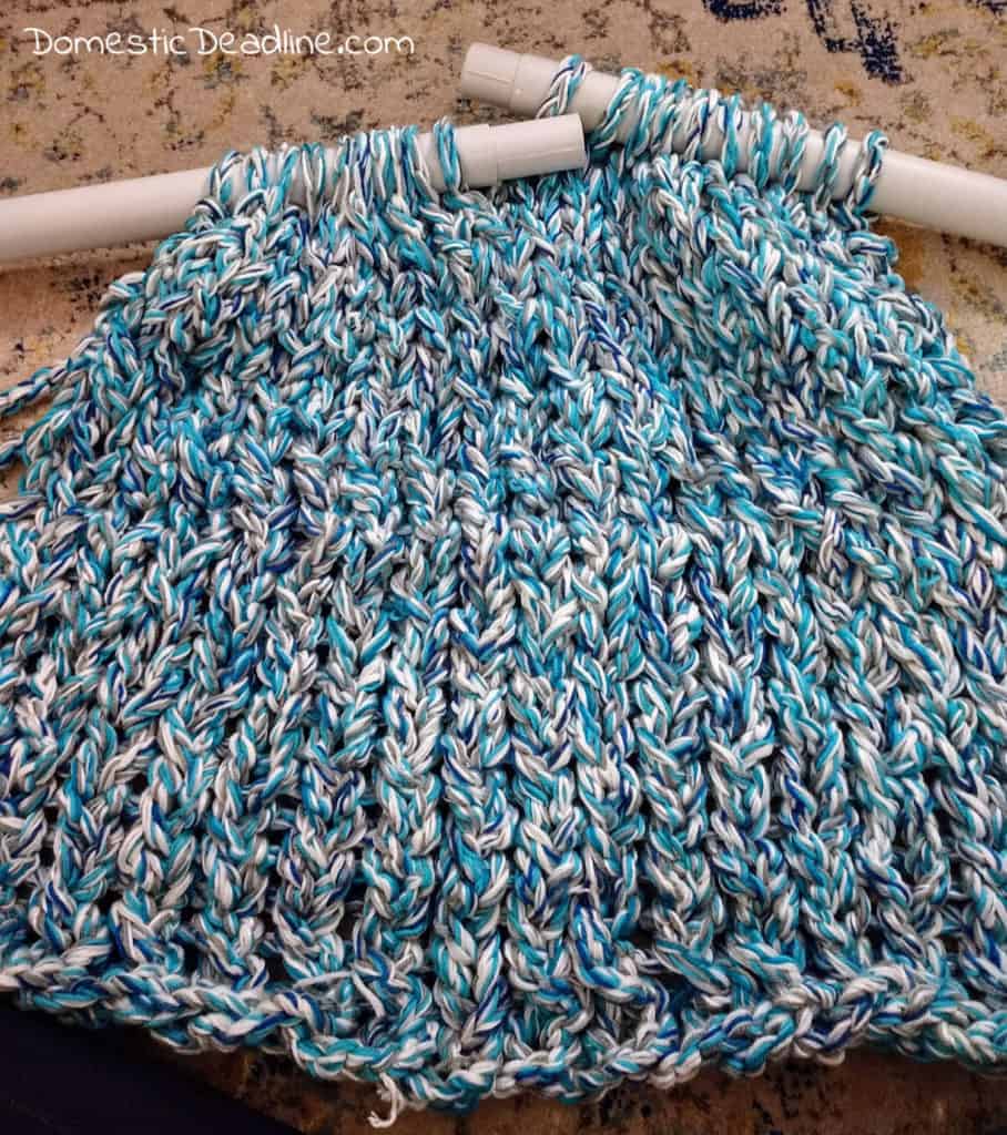 Learn how to turn lots of leftoer yarn into a chunky knit blanket. Customize with any colors to match any decor. Plus stash busting craft blog hop. DomesticDeadline.com