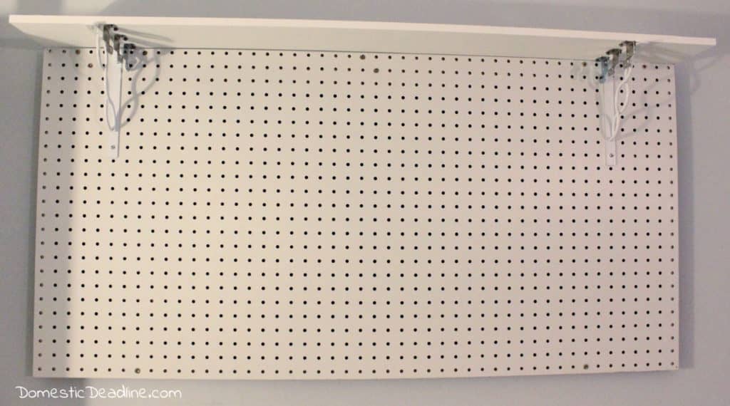 Learn how a pegboard can organize craft supplies making them easily accessible and clearing up horizontal space using vertical space. DomesticDeadline.com