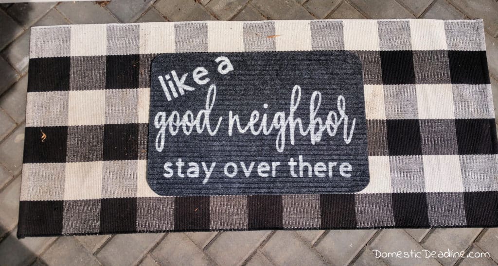 Learn how to make your own social distancing doormat using a dollar store doormat, paint and cricut stencil. Have fun with staying safer at home this summer. DomesticDeadline.com